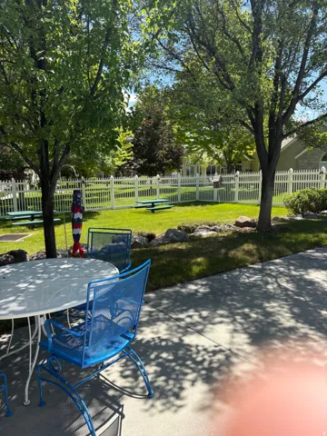 Outdoor patio space with lawn seating and patio furniture.
