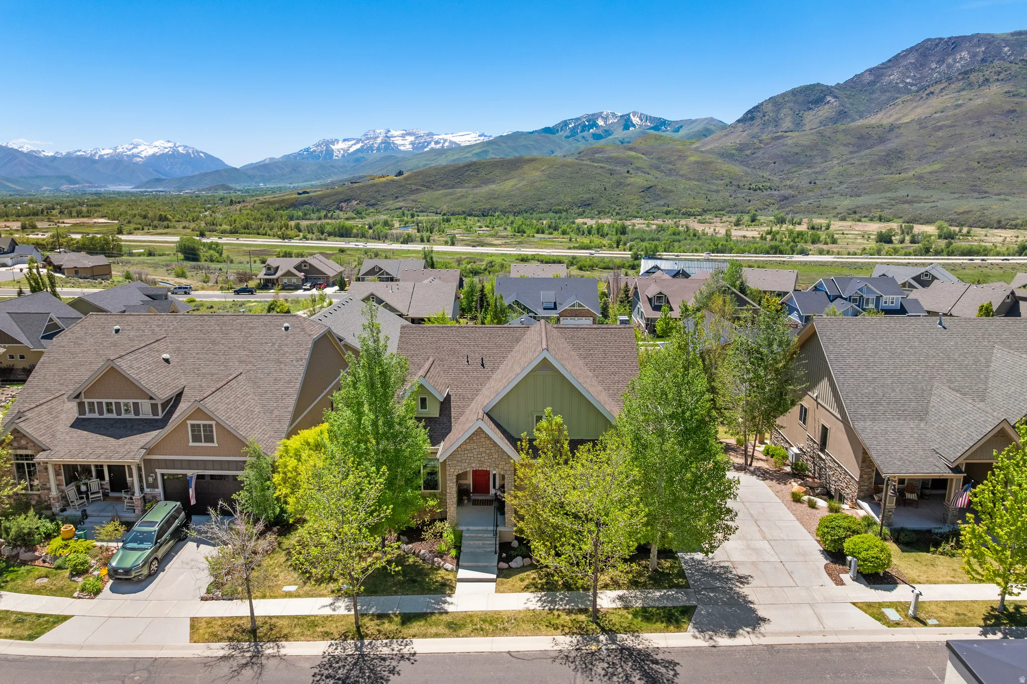 Mountain backdrop framing a residential neighborhood with varied architectural styles