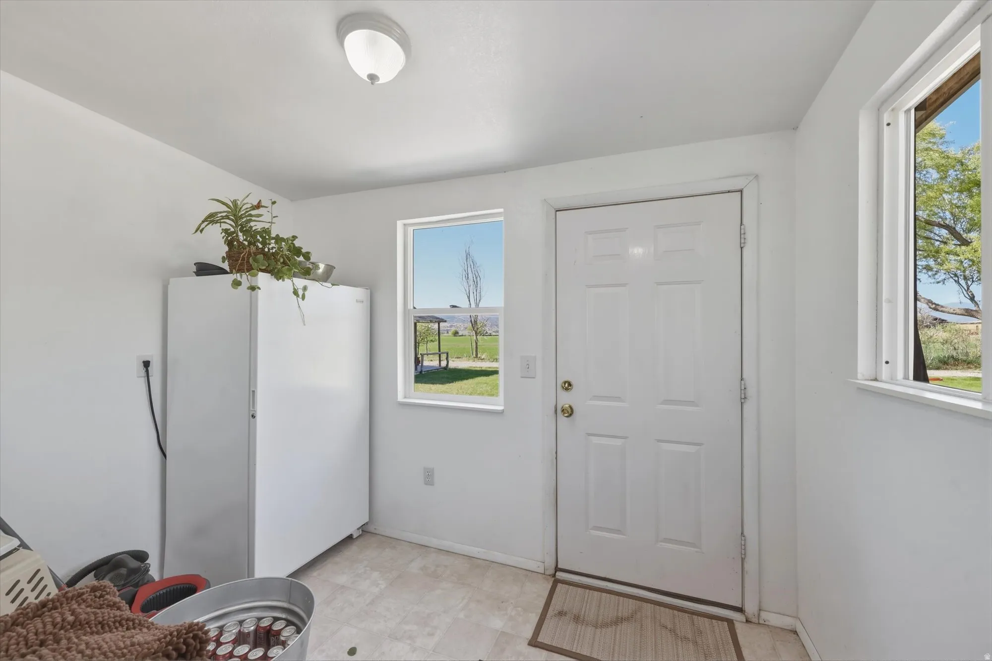 White paneled door with gold hardware