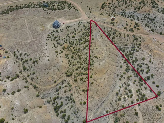 Expansive land parcel featuring natural vegetation and varying terrain