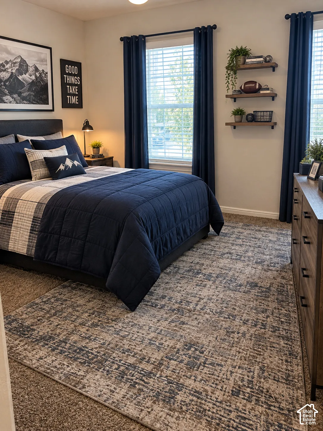 With AI's assistance this is what this Bedroom featuring neutral wall paint, two dual-pane windows, wall-mounted floating wood shelving, and carpeted flooring