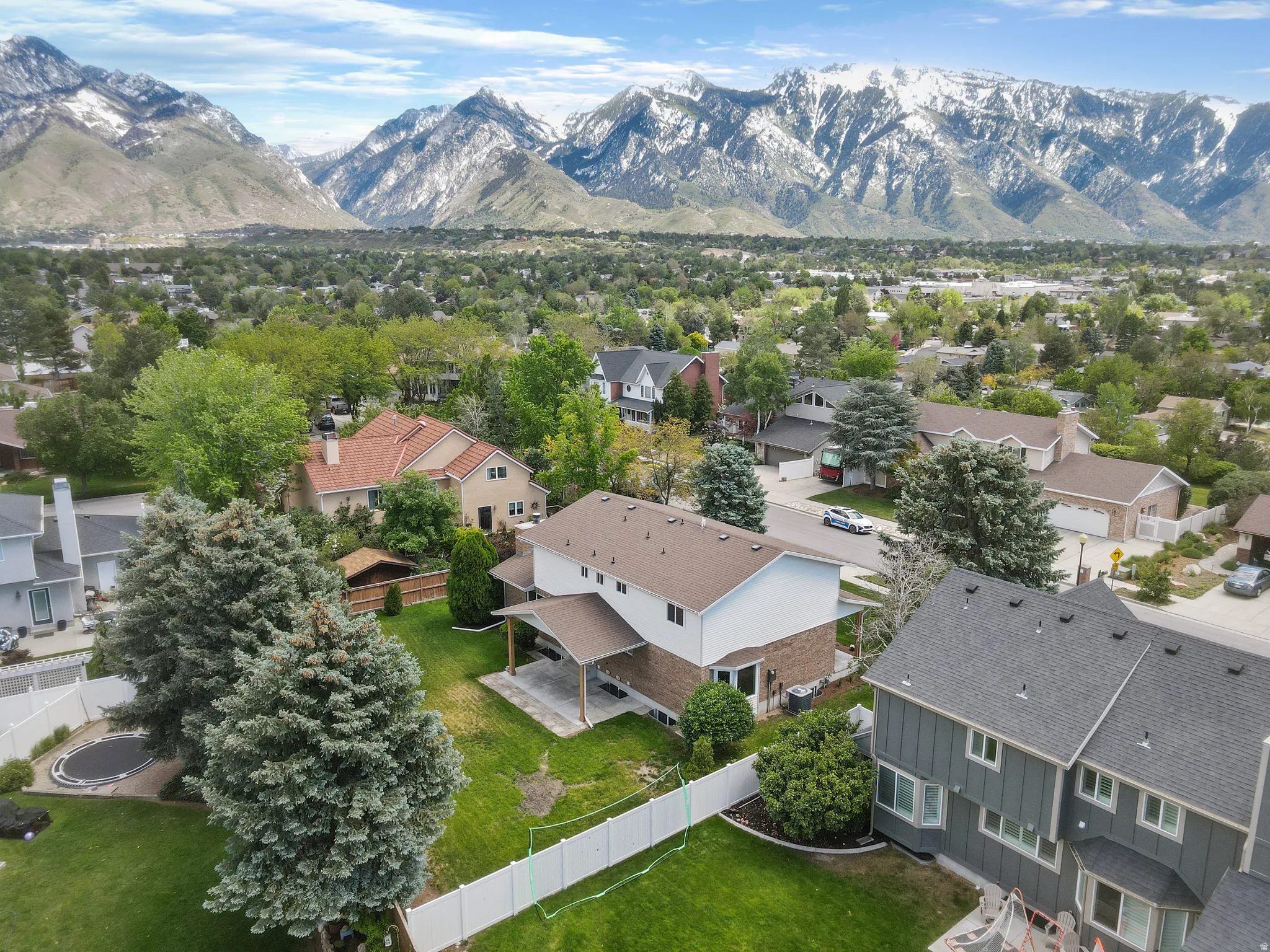 Expansive neighborhood showcasing a backdrop of snow-capped mountains