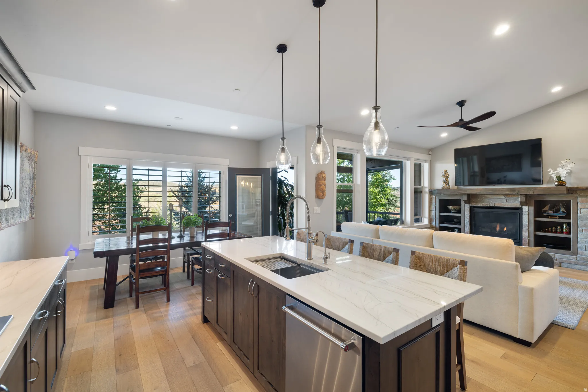 Open-concept living space featuring light wood-finish flooring throughout