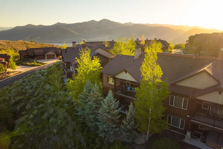 Mountain-style architecture featuring multi-level construction and dark siding
