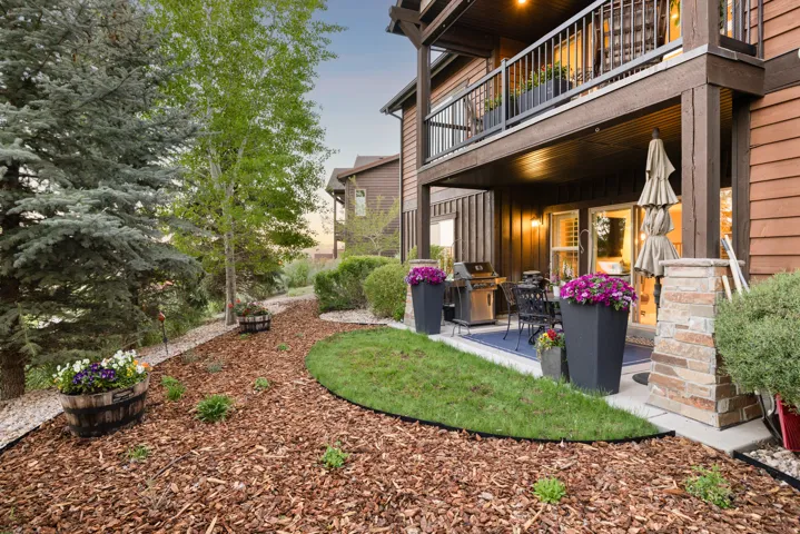 Ground-level patio with concrete surfacing and a blue outdoor rug