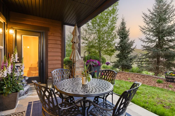 Covered patio featuring a solid ceiling and wood-finish siding