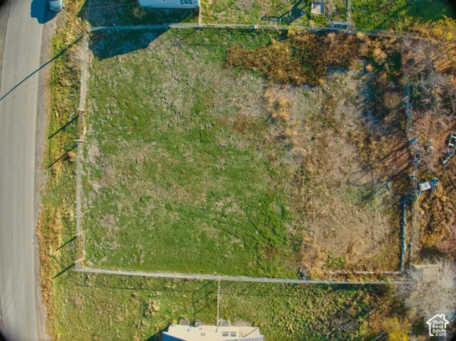 Rectangular lot featuring a partial perimeter fence