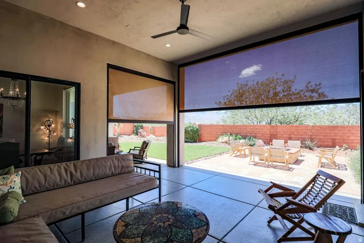 Covered patio with recessed lighting, ceiling fan, and large format concrete-look tile flooring