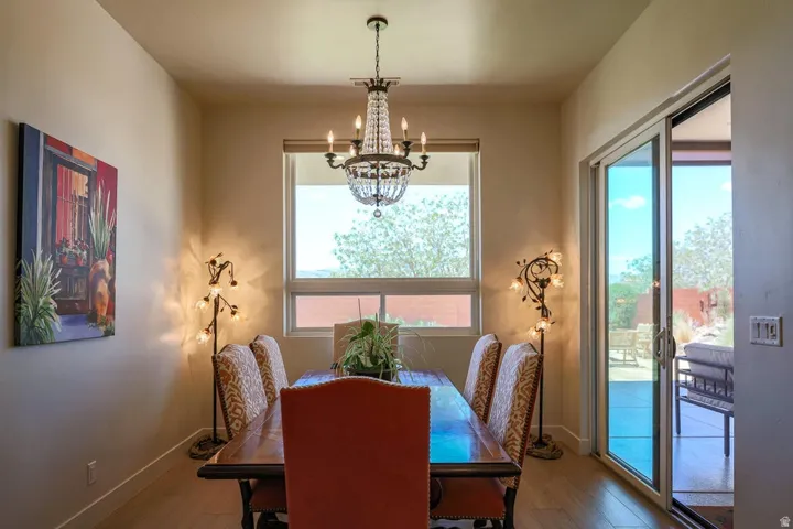 Recessed dining area with wood-finish flooring