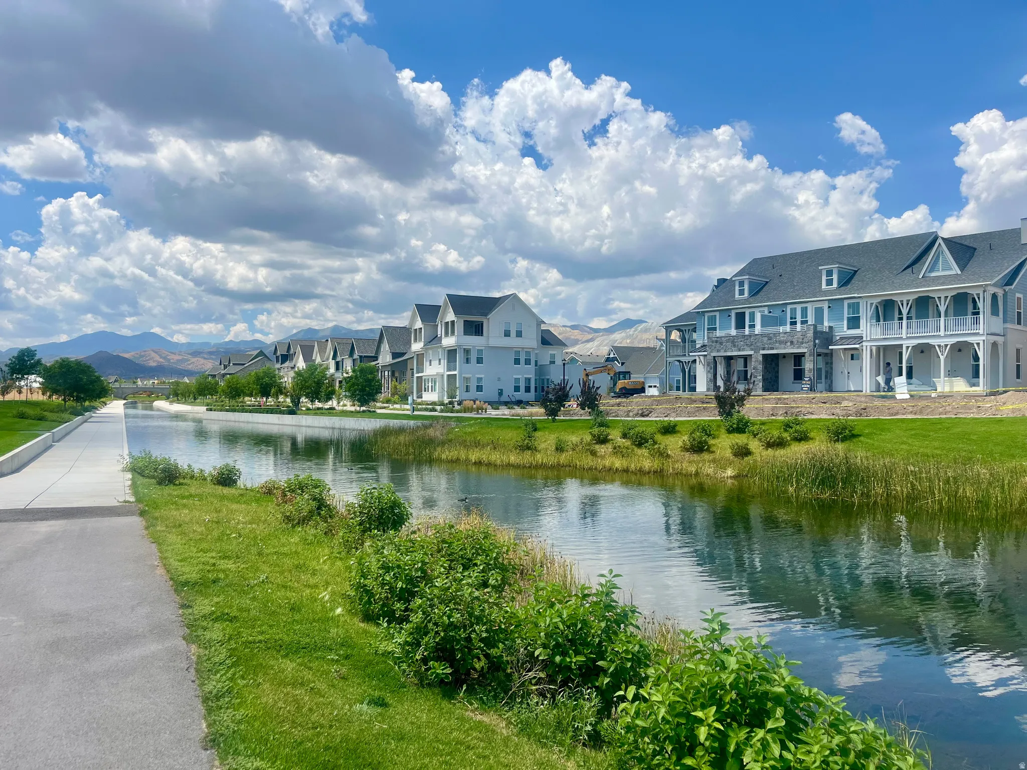 Canal-front homes with mountain backdrops