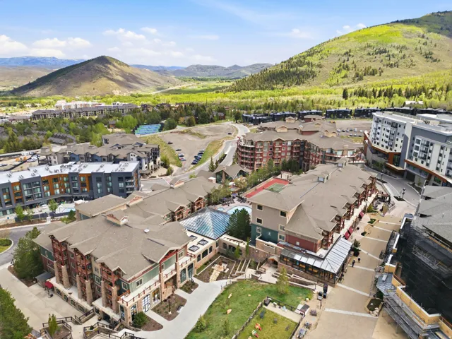 Elevated community featuring multiple multi-story residential buildings and lush green landscapes