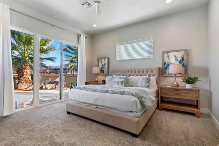 Sliding glass doors opening to an exterior patio with metal railing