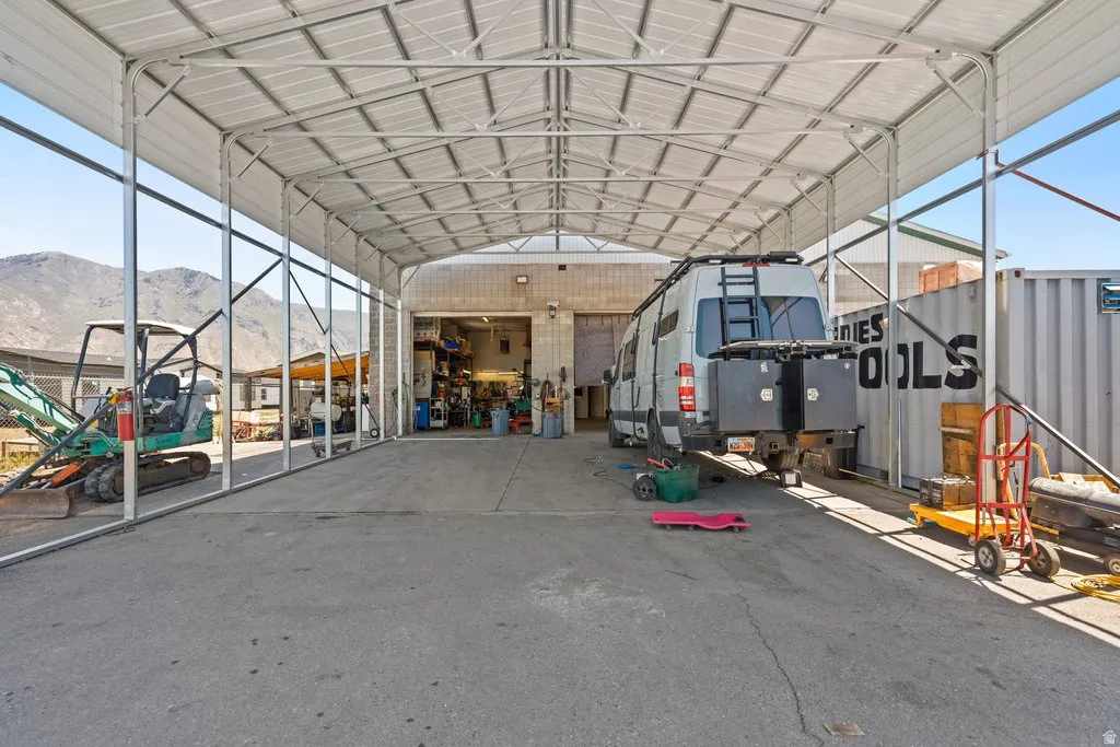 Expansive covered concrete pad with metal frame and roof structure