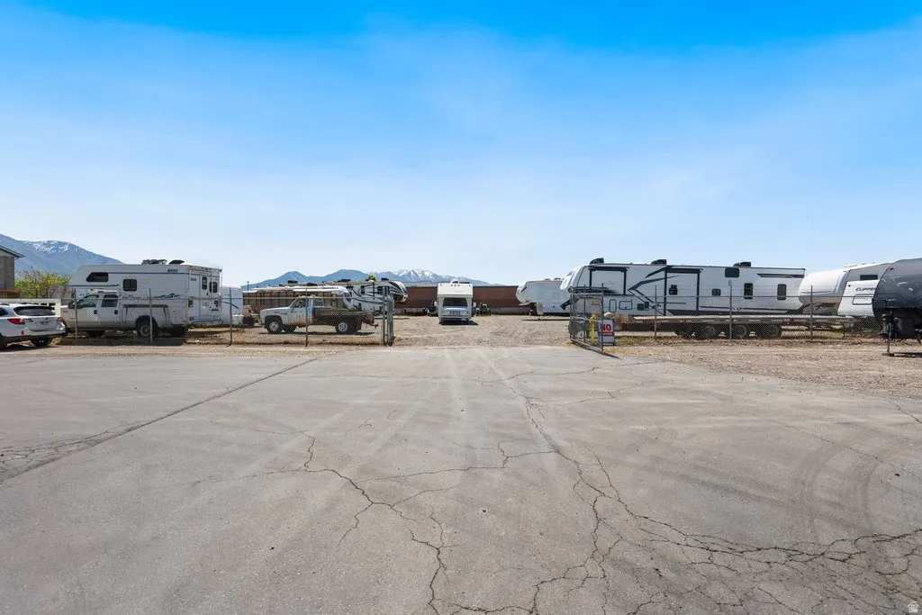 storage  lot featuring a chain-link fence perimeter