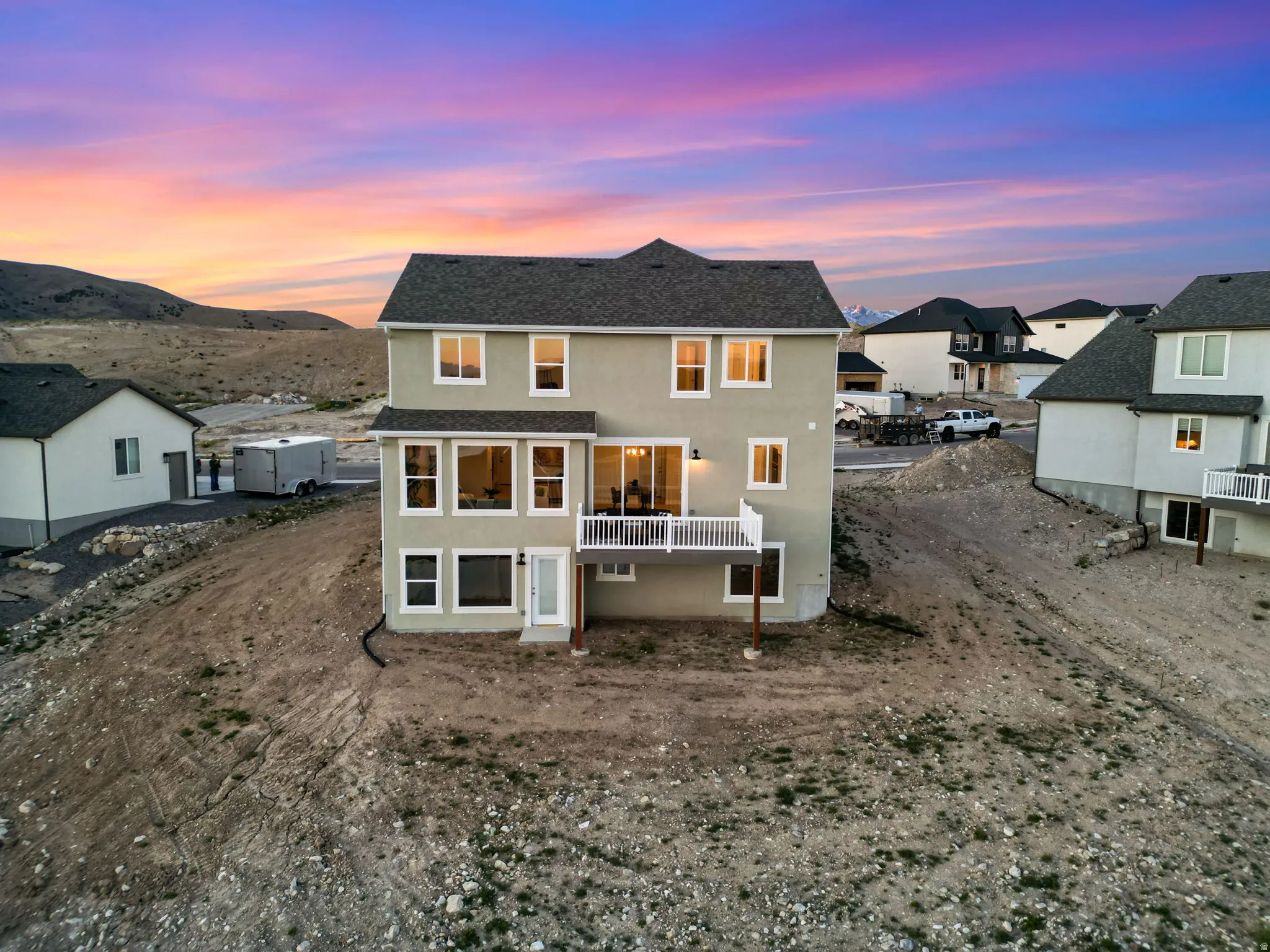 Rear exterior of a two-story residence with a walk-out basement