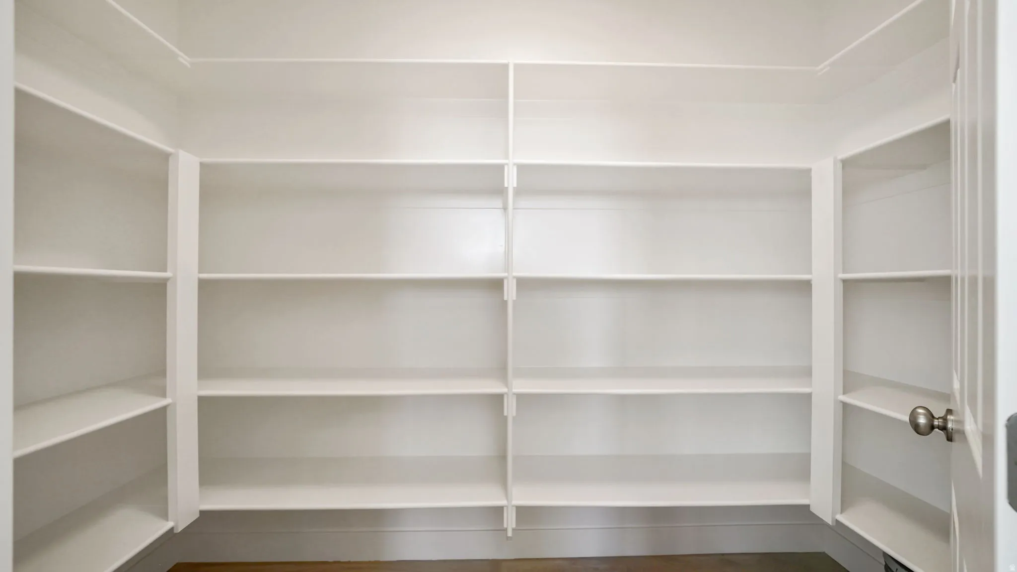 Custom-built shelving providing abundant storage capacity