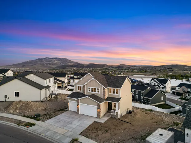Contemporary two-story residence featuring a combination of siding and stone accents