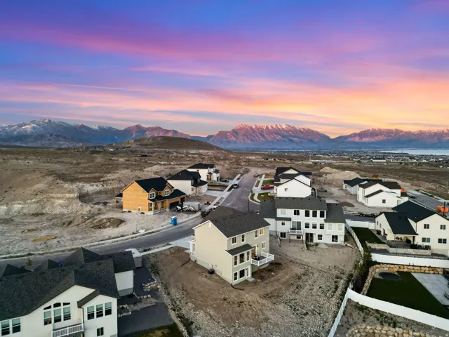 Expansive development featuring new construction homes with mountain and distant water scenery
