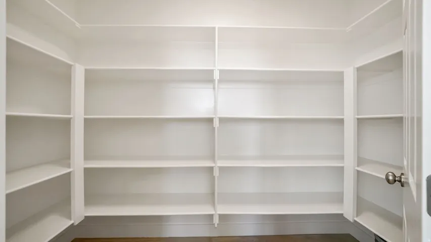Custom-built shelving providing abundant storage capacity