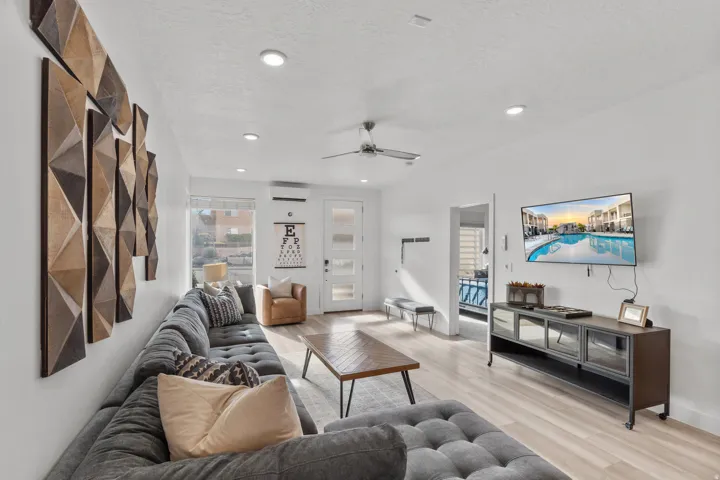Open living area featuring light wood-finish flooring