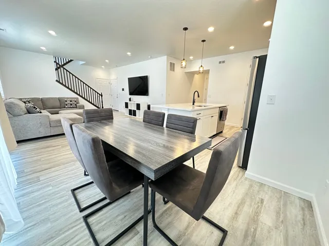 Open-concept living area featuring light wood-finish flooring throughout