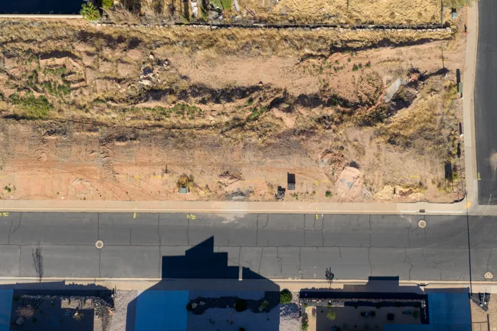 Unimproved lot featuring natural desert landscaping and direct street frontage