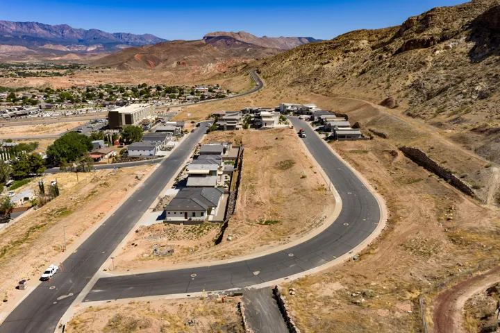 Developing residential area with paved streets and surrounding desert landscape