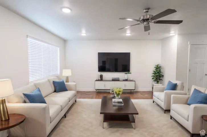 Expansive living area featuring recessed lighting and a ceiling fan