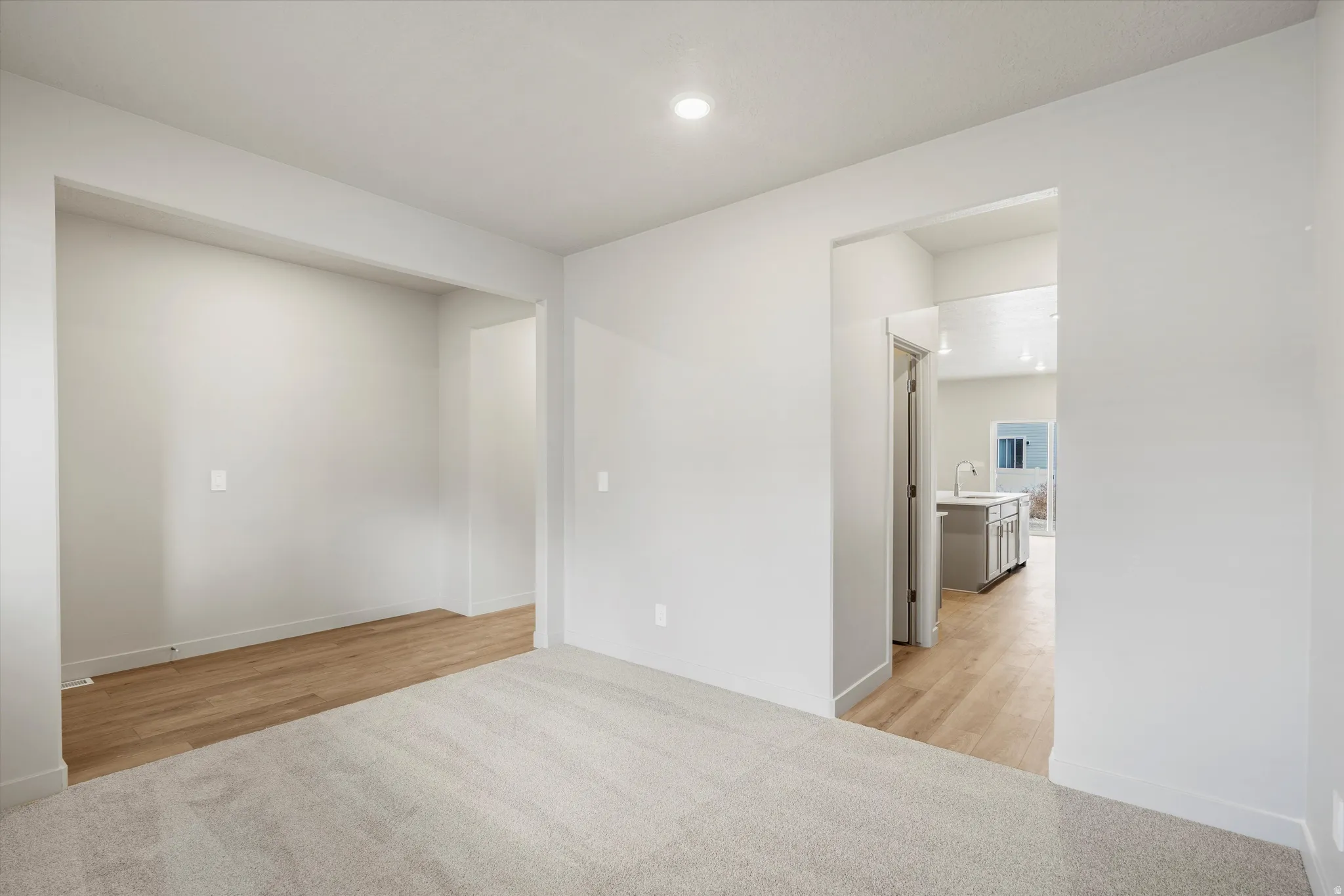 Light gray wall paint complemented by recessed lighting