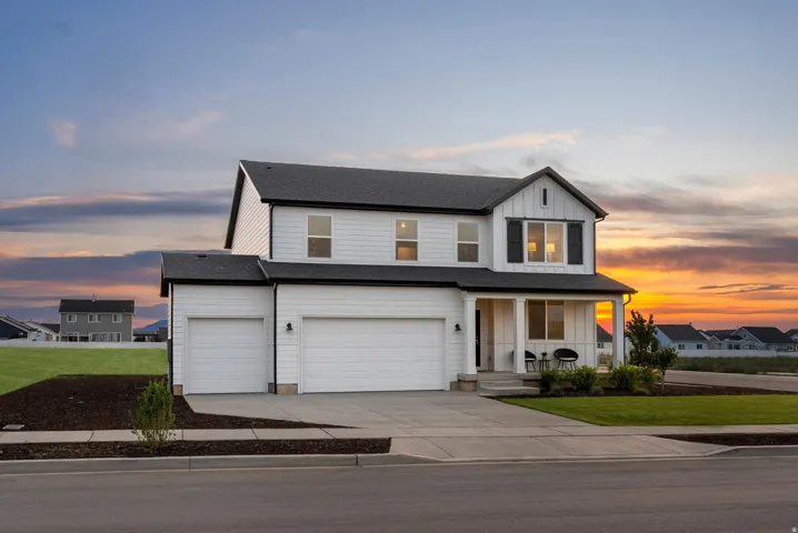 Contemporary two-story residence featuring white siding and a contrasting black roofline