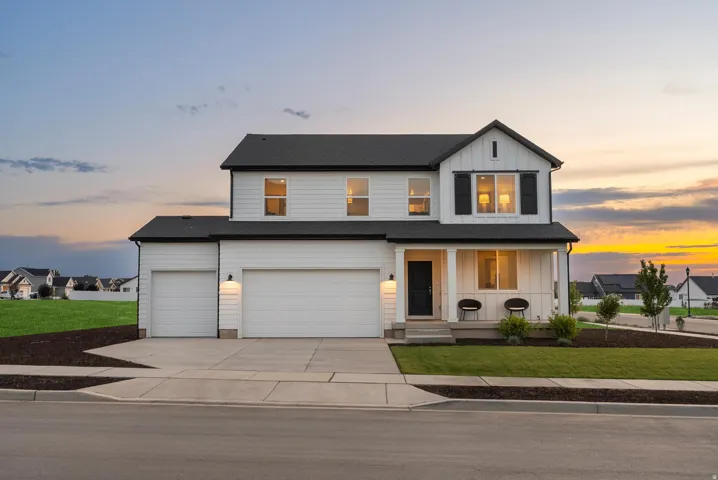 Modern farmhouse exterior with white siding and dark trim