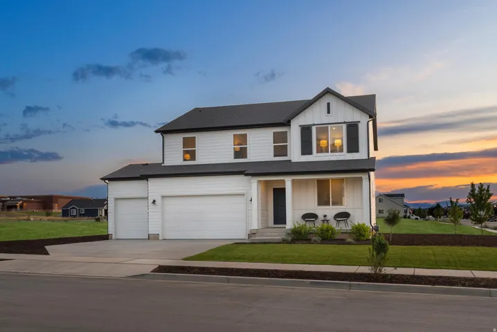 Modern farmhouse exterior with white siding and dark trim