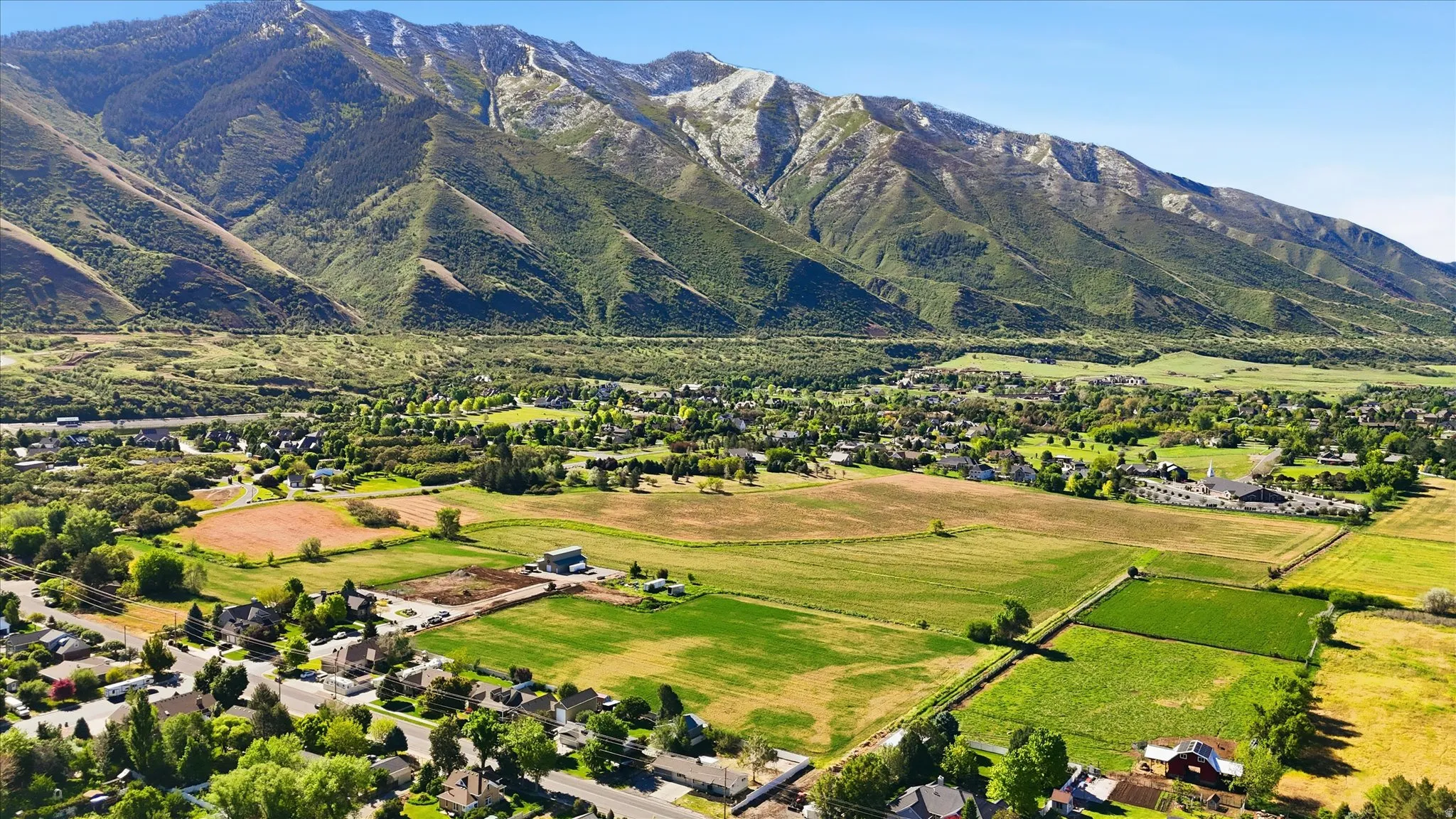 Sprawling mountain landscape with verdant foothills