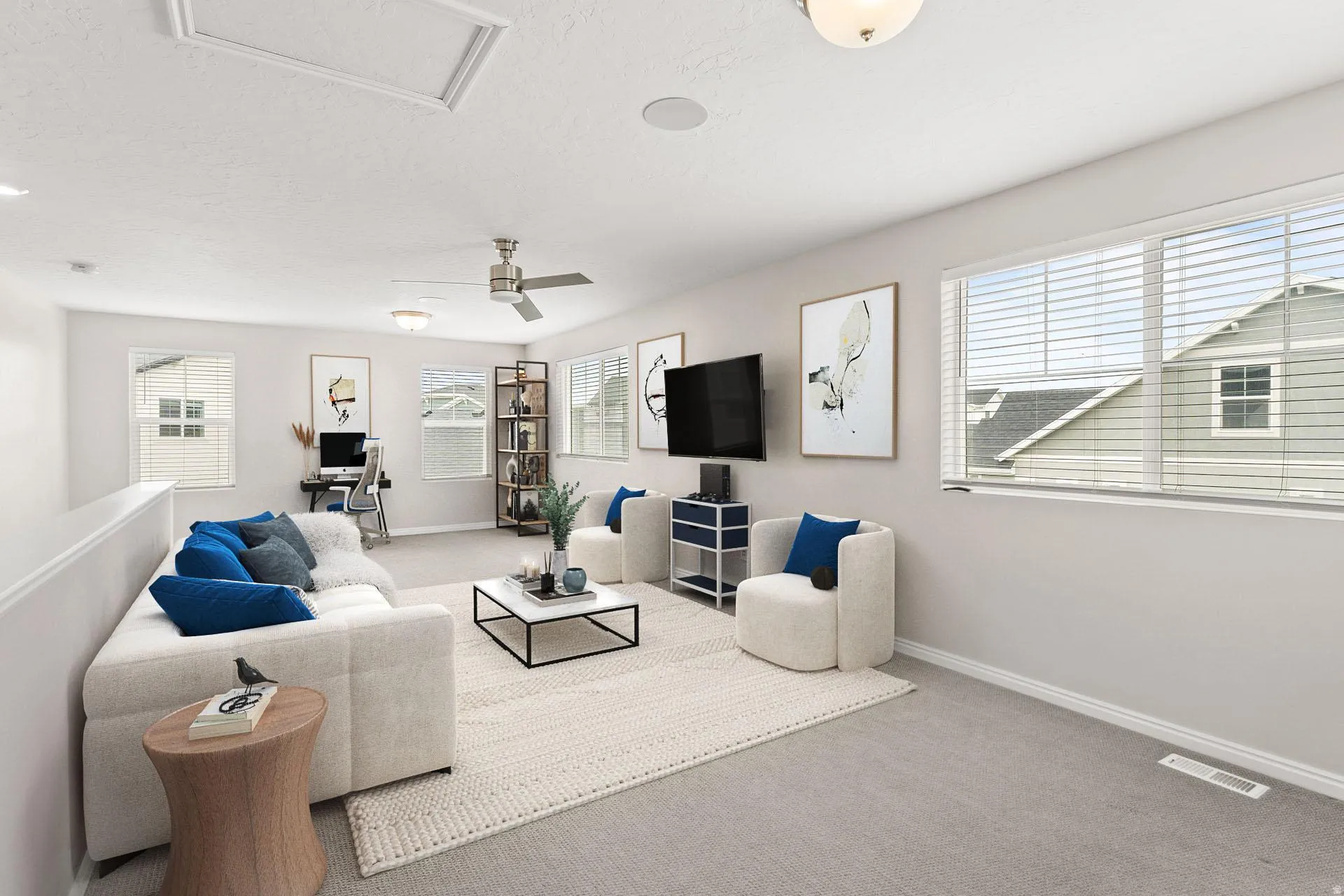 Carpeted loft area featuring a ceiling fan, recessed lighting, and multiple windows with blinds