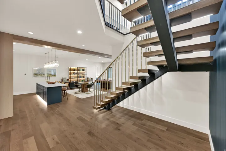 Modern open-tread staircase with metal stringers and wood steps