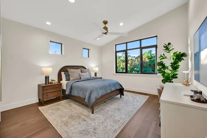 Bedroom featuring vaulted ceilings and recessed lighting