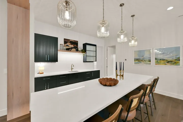 Spacious island featuring a white countertop and seating for four