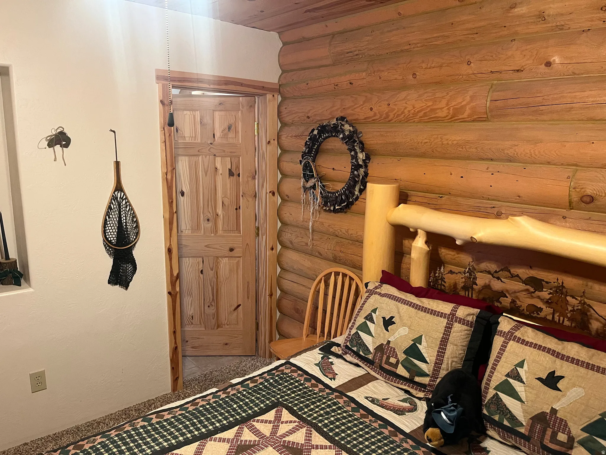 Log-style interior wall construction featuring natural wood tones