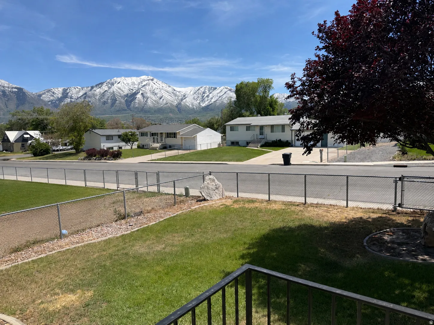 Snow-capped mountain range providing a dramatic backdrop to the residential area