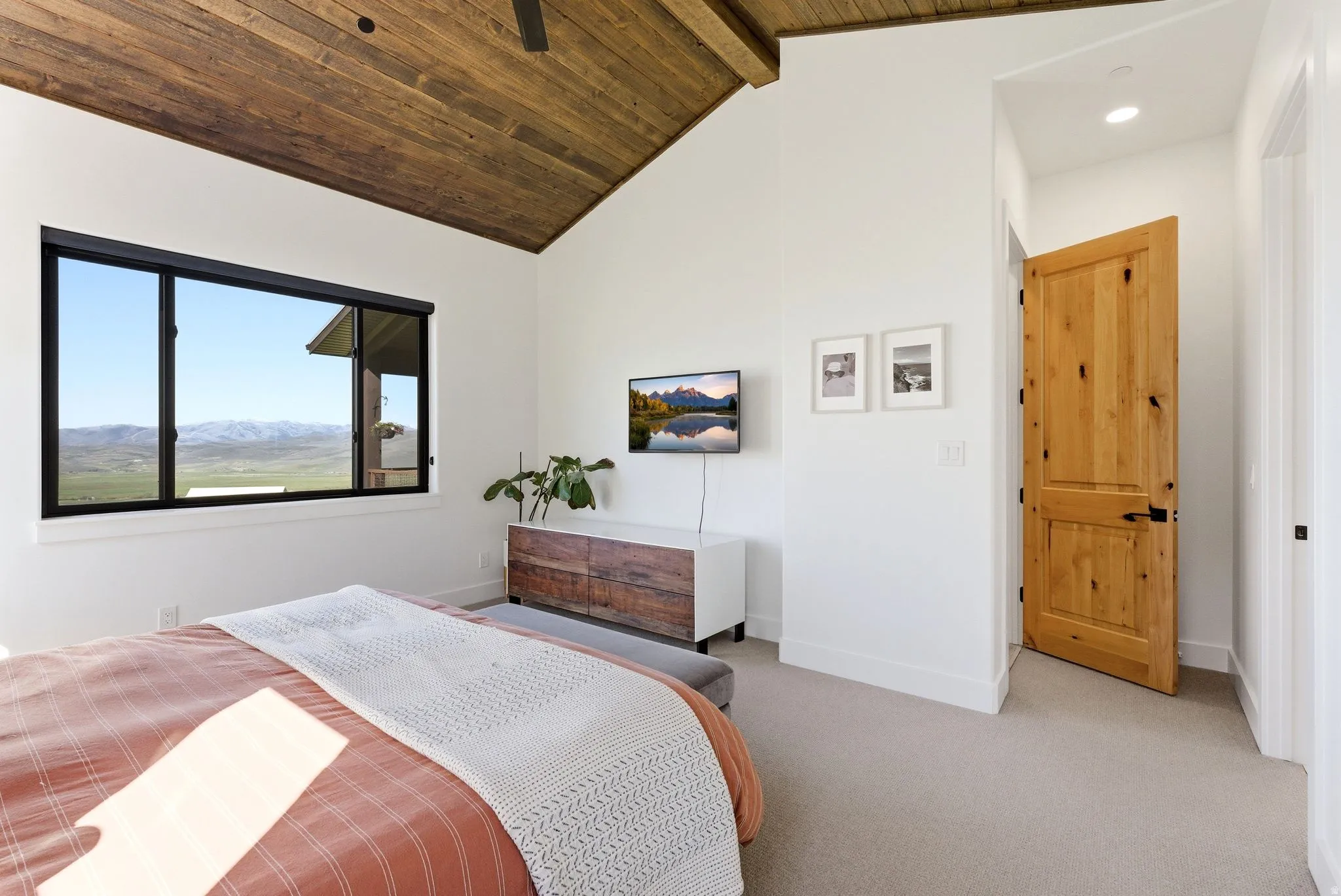 Vaulted wood-finish ceiling with exposed beams
