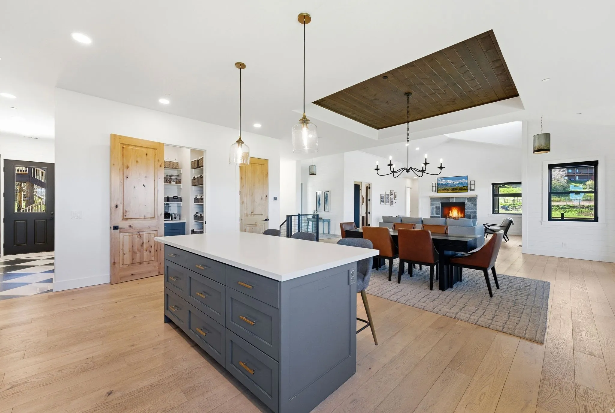 Kitchen island with a white countertop and gold-toned hardware
