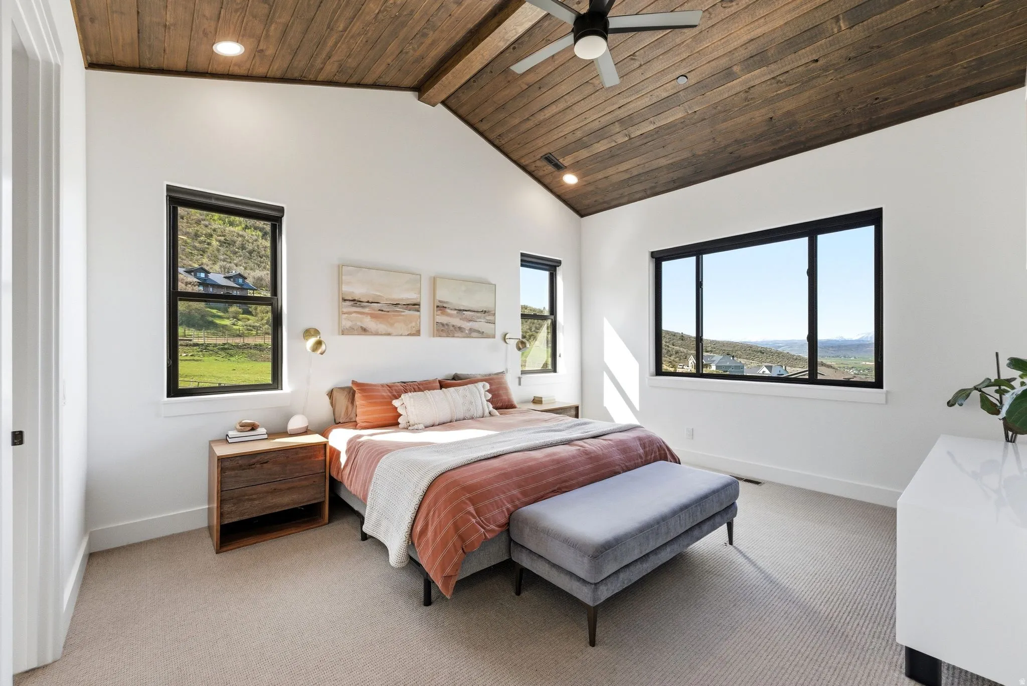 Vaulted wood-paneled ceiling with exposed beam