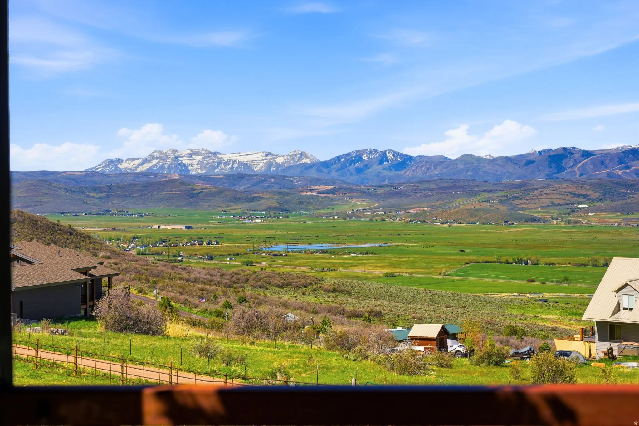 Expansive mountain range backdrop with snow-capped peaks