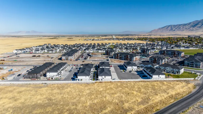 Expansive development featuring a mix of townhomes and multi-story residential buildings