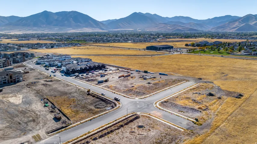 Expansive undeveloped land with newly paved roads and infrastructure