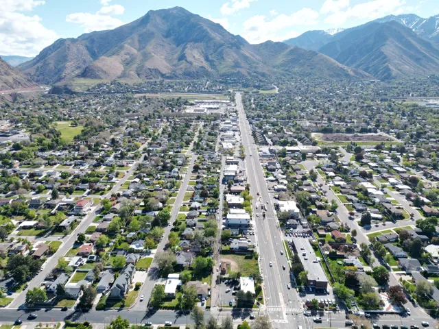 Aerial perspective showcasing a developed residential area with mountain backdrops