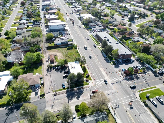 Aerial perspective showcasing a mixed-use commercial and residential thoroughfare