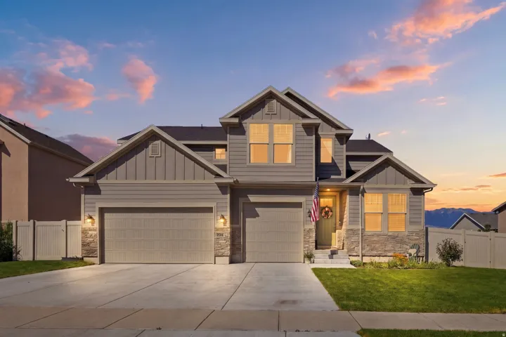 Contemporary two-story residence featuring a combination of siding and stone veneer