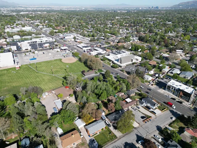 Aerial perspective showcasing established residential areas alongside commercial properties and expansive green spaces