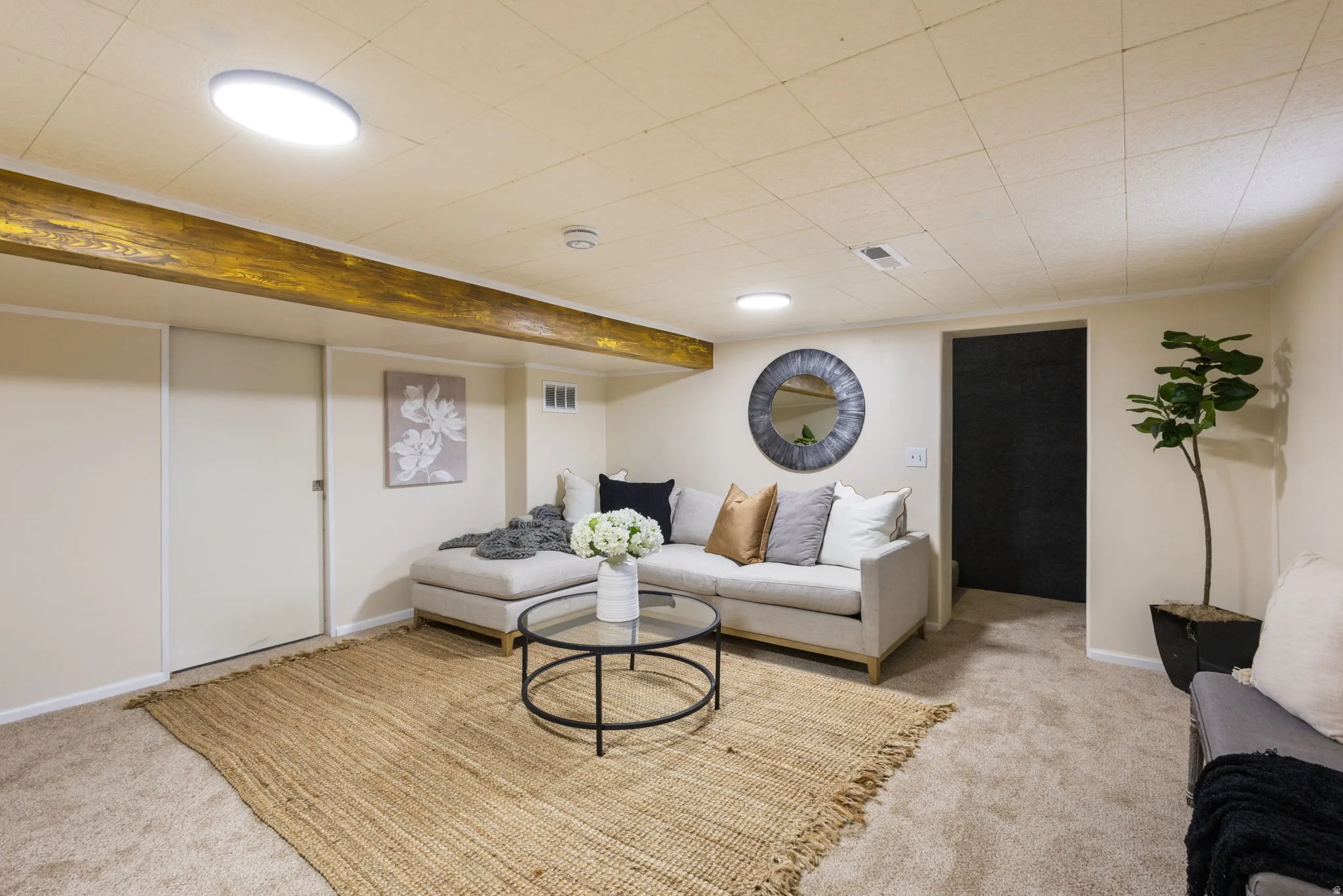 Carpeted room with recessed lighting and access to the laundry room. Basement Family Room View #2.